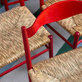 Eight 1970s red Italian dining chairs in the style of Gio Ponti